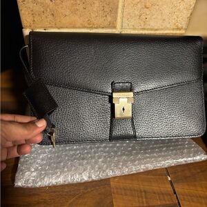 Salvatore Ferragamo Black Clutch with Gold Accent